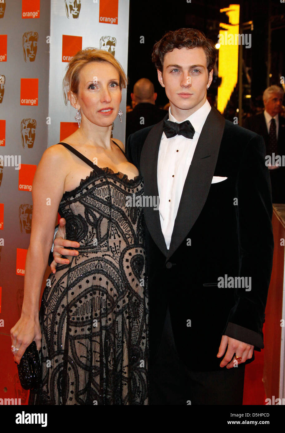 British director Sam Taylor Wood (L) and British actor Aaron Johnson arrive for the 2010 Orange British Academy Film Awards (BAFTA) held at the Royal Opera House in London, Great Britain, 21 February 2010. The BAFTAs are the biggest and most prestigious British film awards honouring British as well as international cinematic talent. Photo: Hubert Boesl Stock Photo