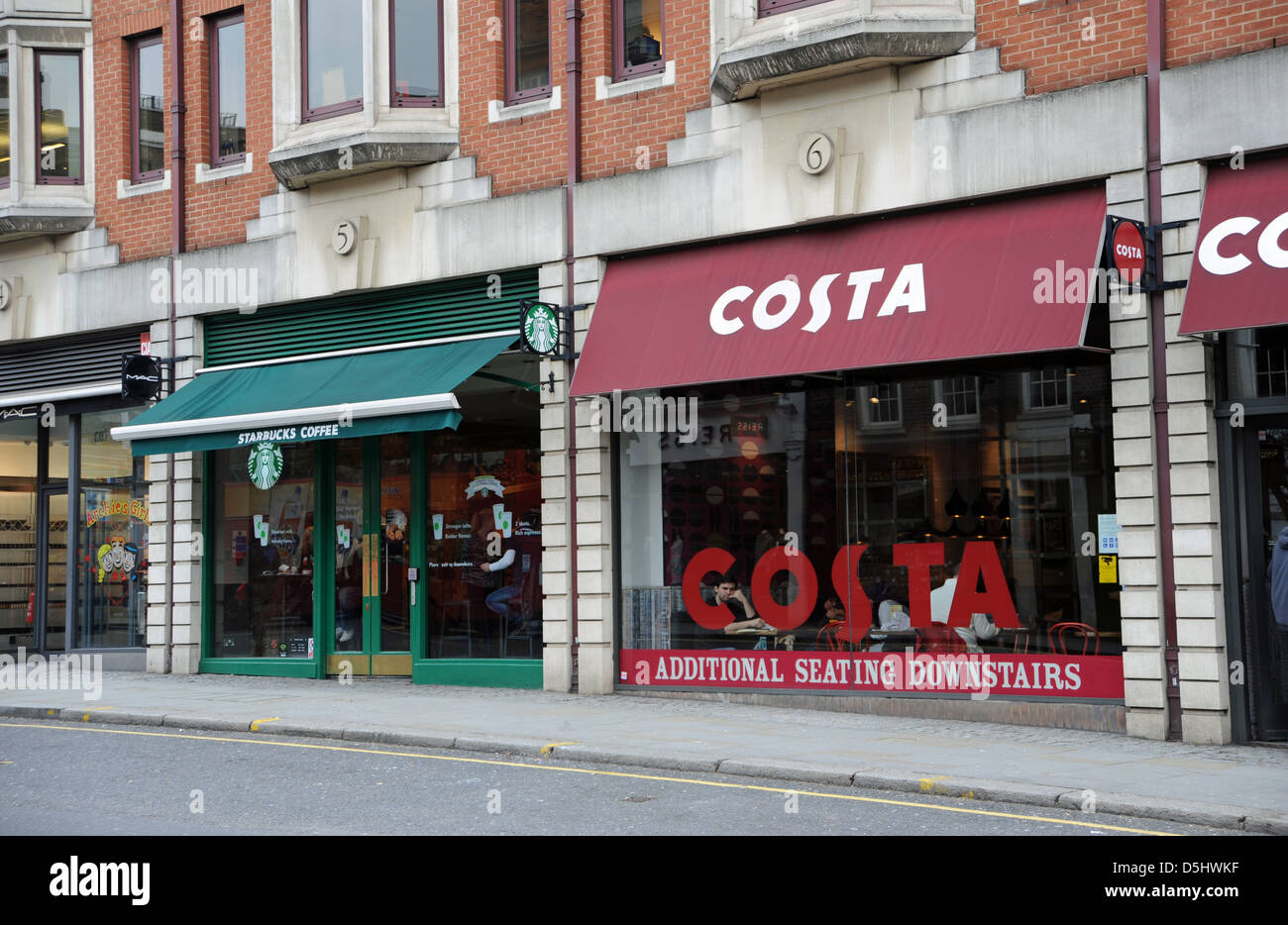 Costa Coffee and Starbucks cafes next door to each other in Kensington