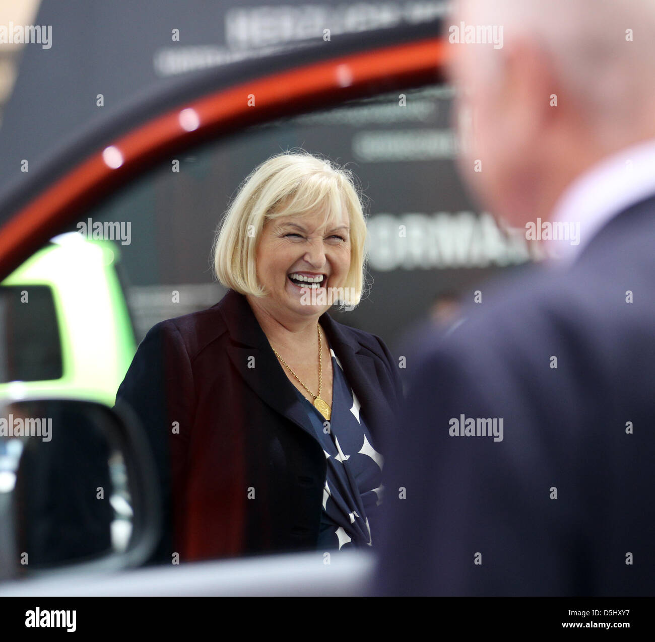Ursula Piech, member of the supervisory board at Volkswagen, smiles through a pane of glass at the Volkswagen stand at the IAA Frankfurt Motor Show for commercial vehichles in Hanover, Germany, 18 September 2012. The 64th IAA commercial vehichles fair runs from 20 until 27 September 2012. Photo: FRISO GENTSCH Stock Photo