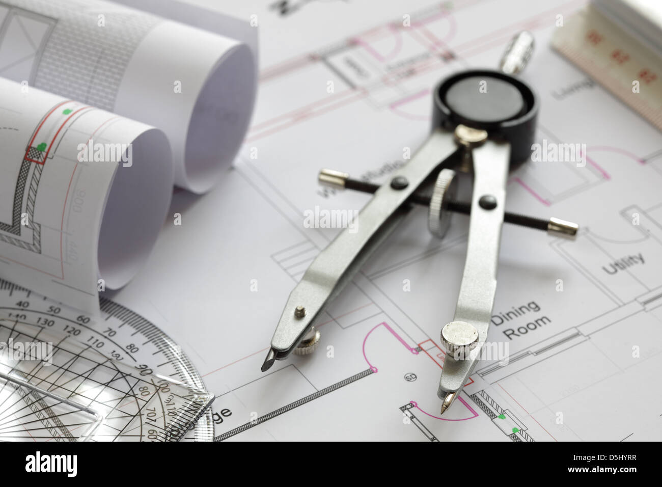 Drawing compass on house plan Stock Photo