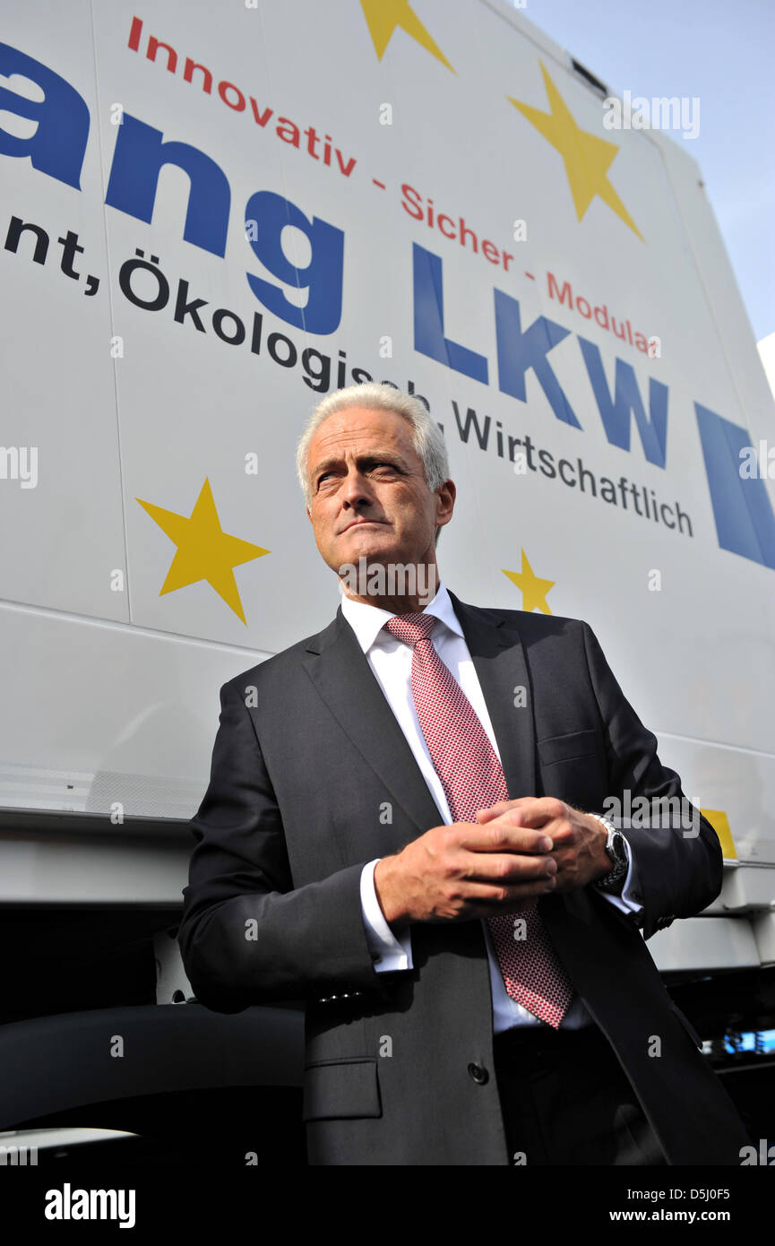 German Minister of Transport Peter Ramsauer (CSU) stands in front of a long truck of company Krone at the International Automobile Exhibition (IAA) Commercial Vehicles in Hanover, Germany, 20 September 2012. 1904 exhibitors are presenting their novelties from 20 till 27 September 2012 at the trade show. Photo: EMILY WABITSCH Stock Photo
