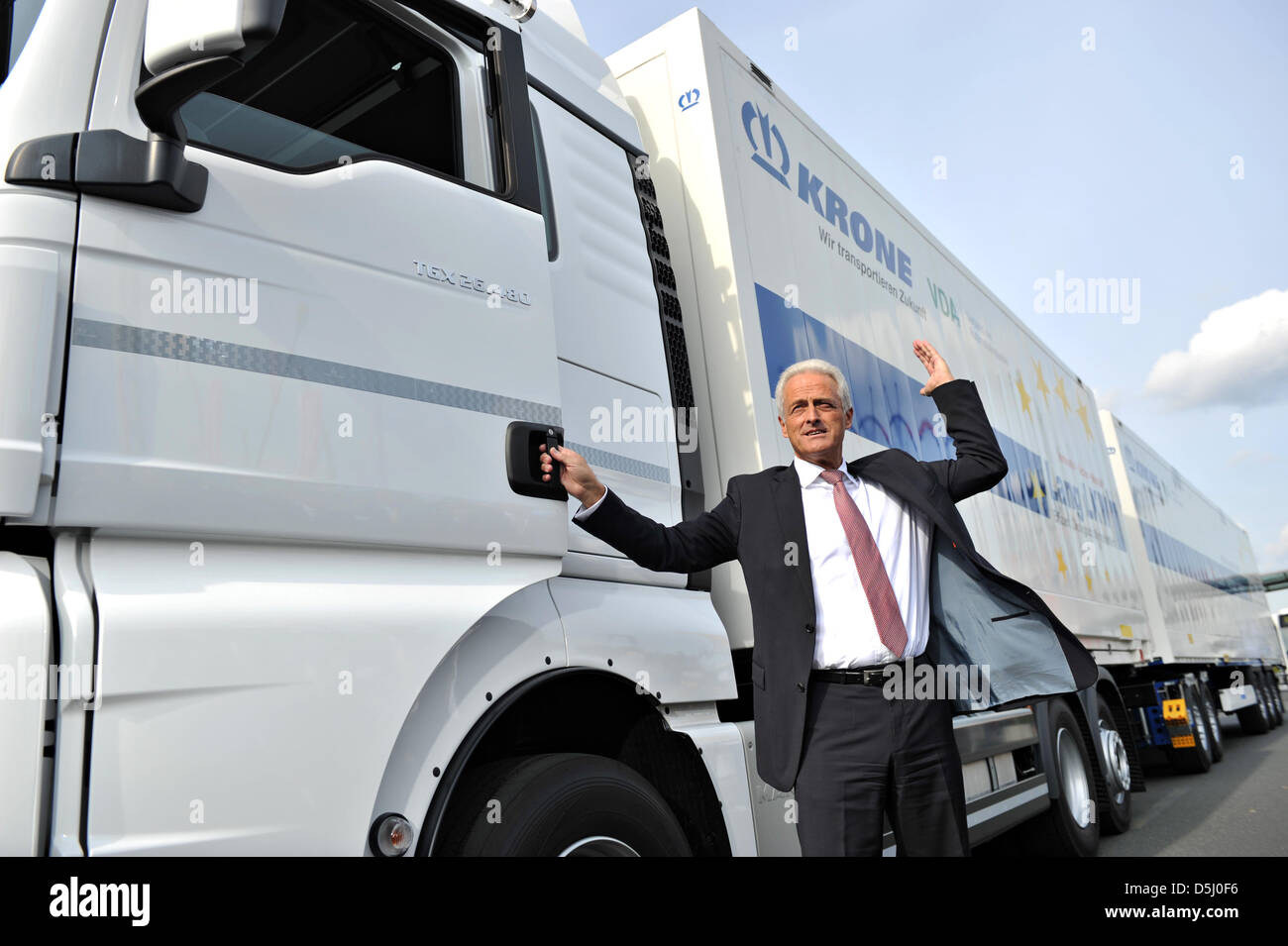 German Minister of Transport Peter Ramsauer (CSU) stands in front of a long truck of company Krone at the International Automobile Exhibition (IAA) Commercial Vehicles in Hanover, Germany, 20 September 2012. 1904 exhibitors are presenting their novelties from 20 till 27 September 2012 at the trade show. Photo: EMILY WABITSCH Stock Photo
