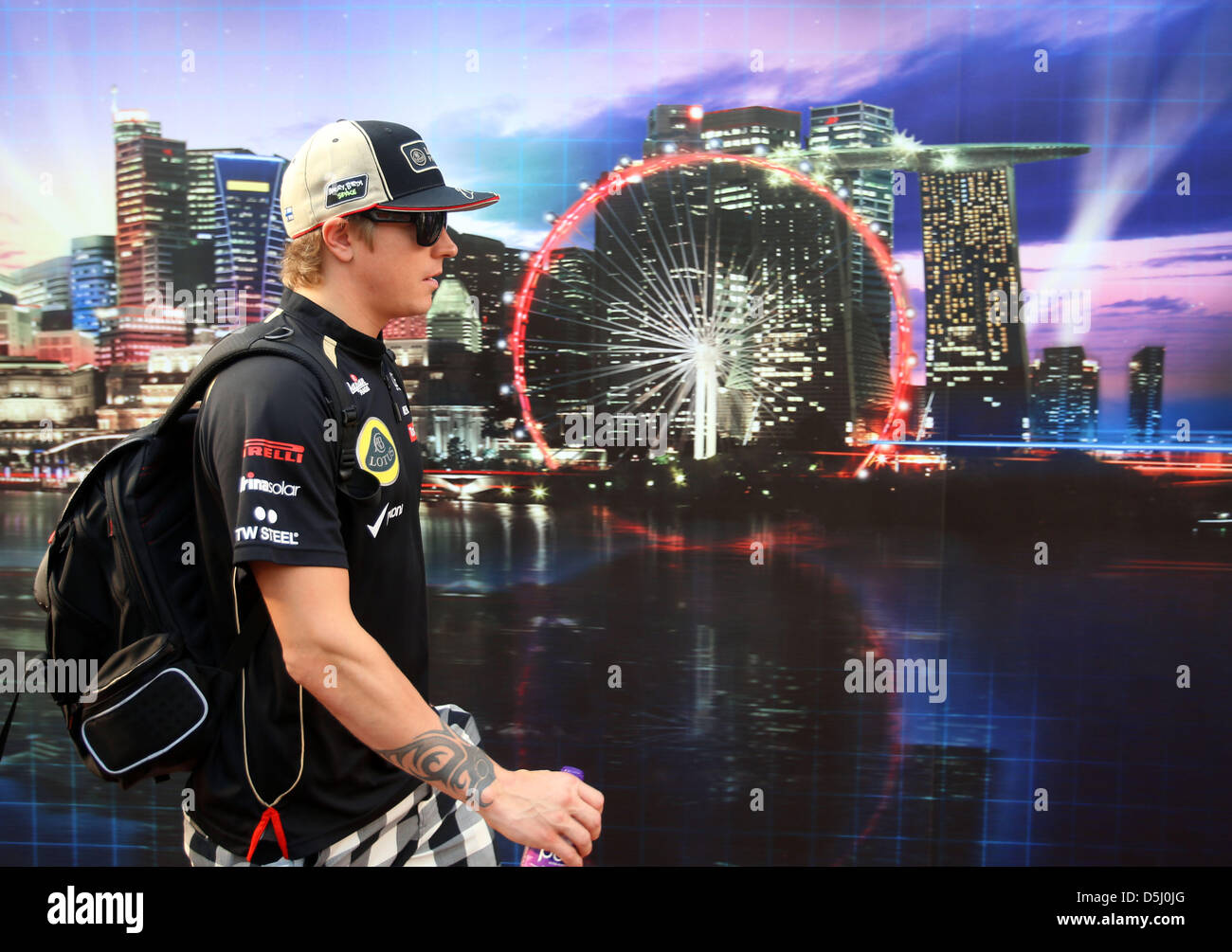 Finnish Formula One driver Kimi Raikkonen of Lotus arrives at the