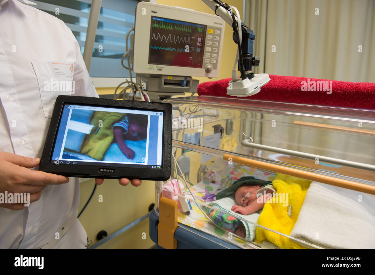 A webcam records a baby in the premature birth room at the children's  clinic in Passau, Germany, 12 November 2012. Parents get the chance to  virtually be with their children through a