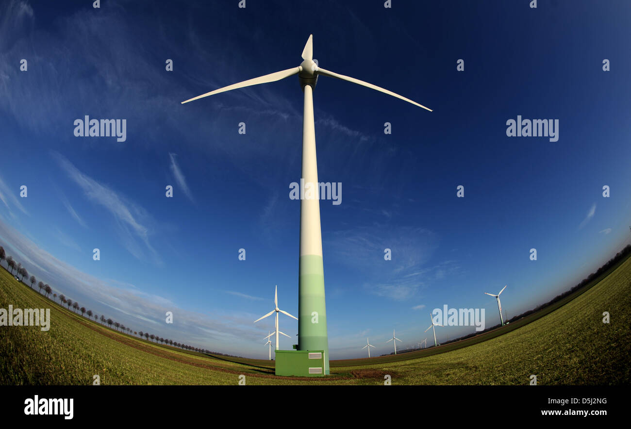 Wind turbines stand on a field near Sarstedt, Germany, 13 November 2012. Photo: JULIAN STRATENSCHULTE Stock Photo