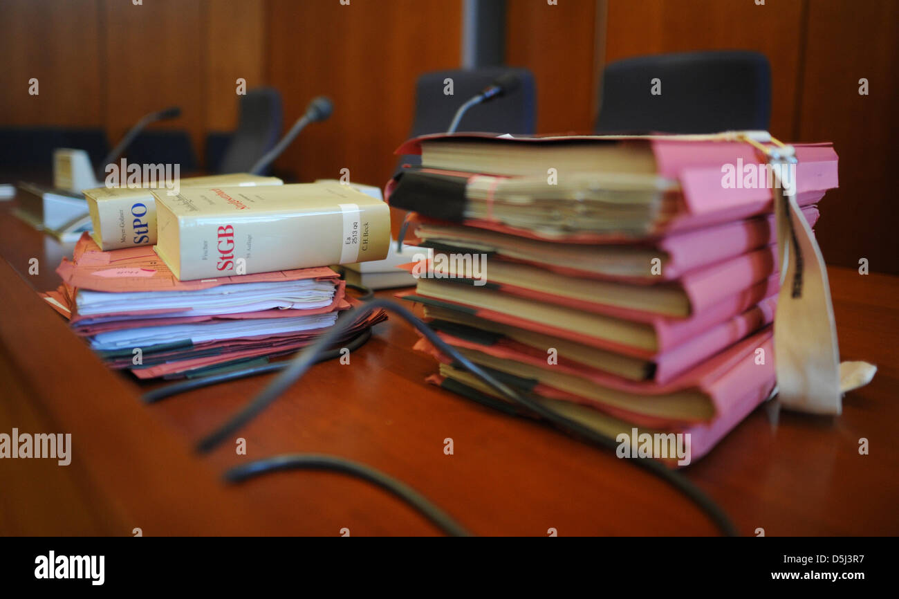 Binders sit on the table at the Regional Court in Goettingen, Germany, 14 November 2012. Former