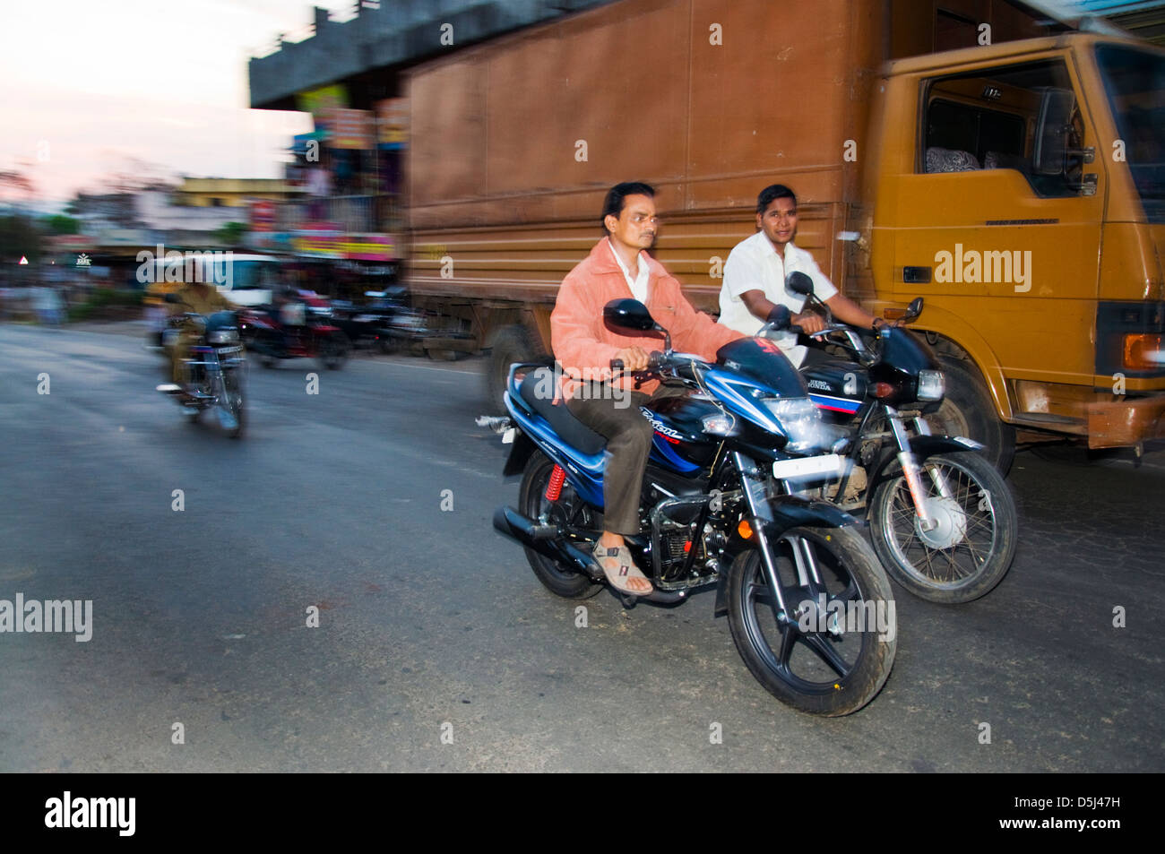 Indian men riding motorbikes without helmets Stock Photo