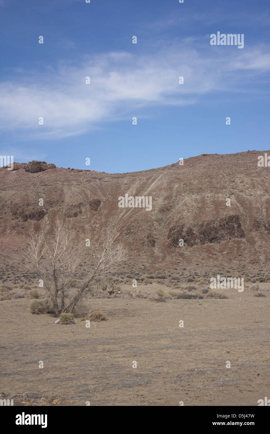 Desert mountain with blue skies and random clouds Stock Photo - Alamy