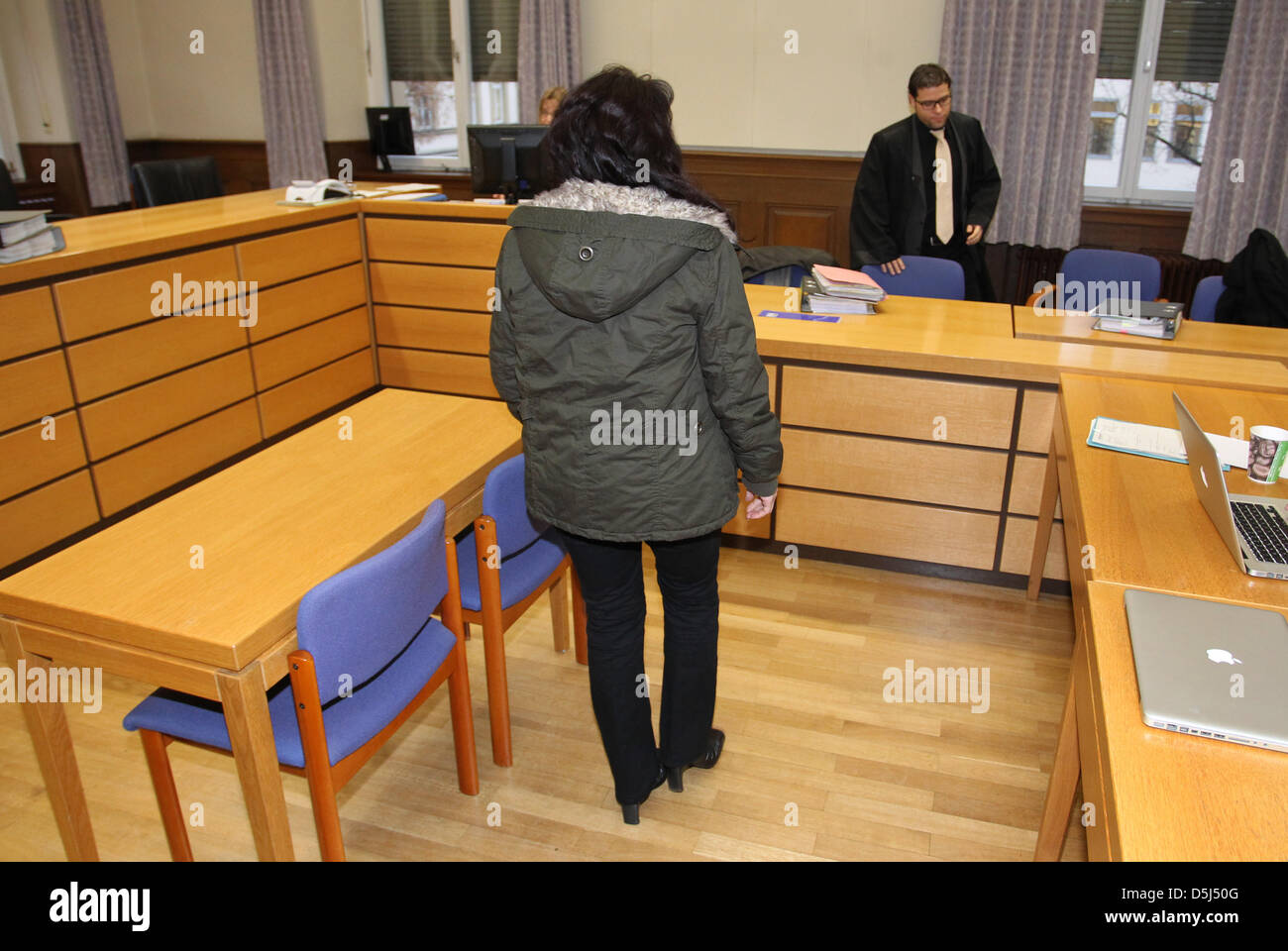 A woman arrives at the district court in Schweinfurt, Germany, 15 November 2012. The 43-year-old woman is accused of stabbing her husband to death during a fight in December 2011. Photo: Karl-Josef Hildenbrand Stock Photo