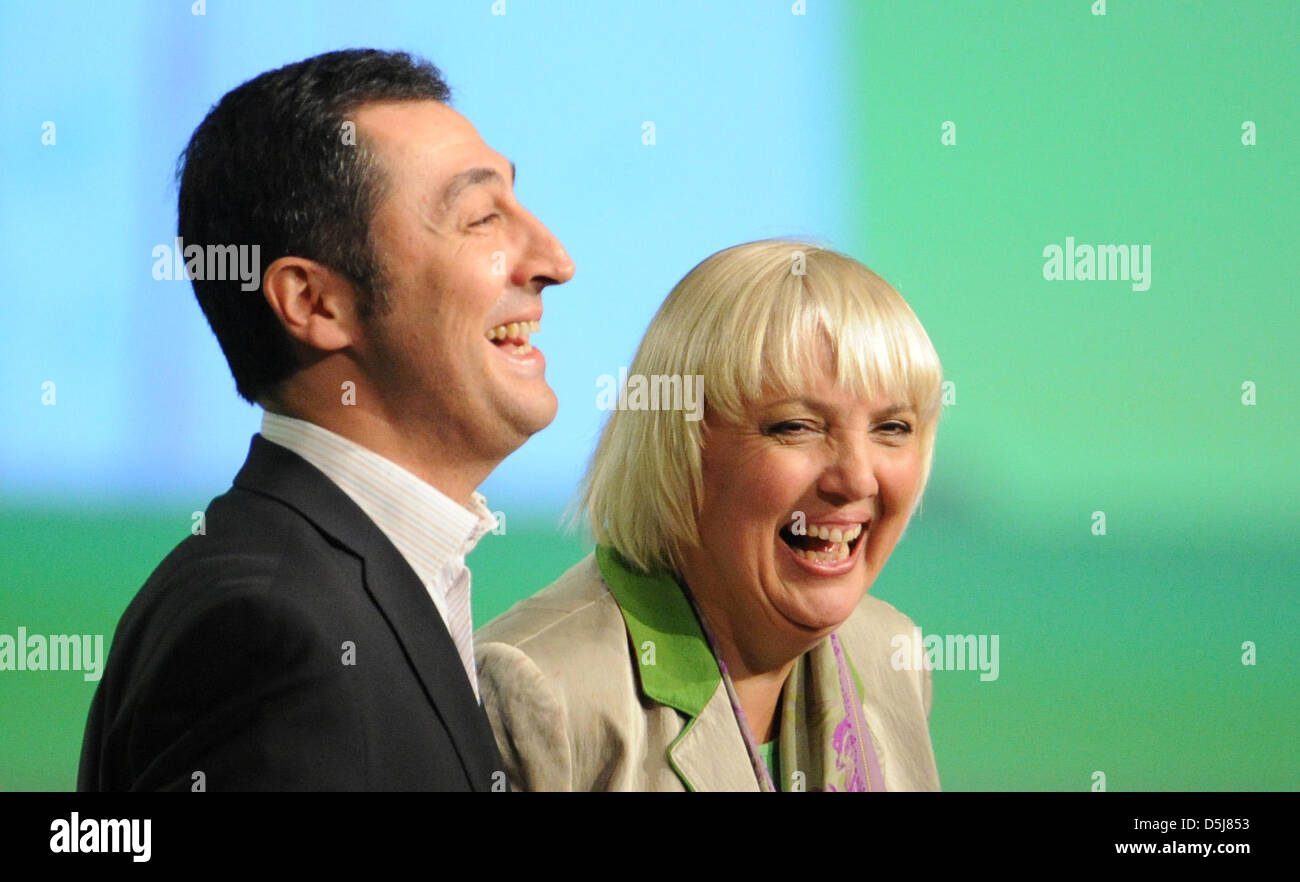 The federal heads of the Green Party, Claudia Roth and Cem Oezdemir, cheer after hearing the election results at the 34th delegate conference at Eilenriedehalle in Hanover, Germany, 17 November 2012. Photo: Julian Stratenschulte Stock Photo