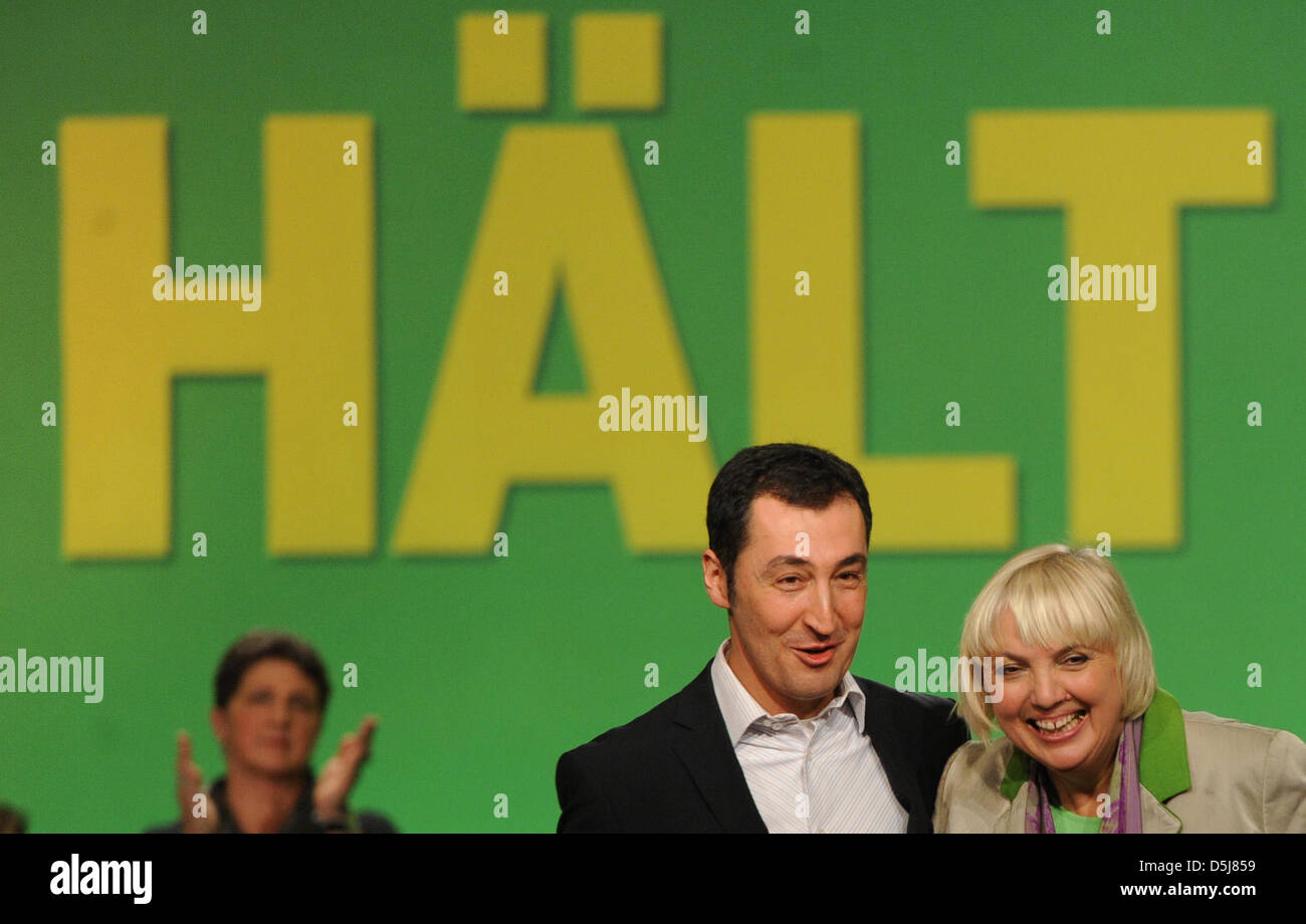 The federal heads of the Green Party, Claudia Roth and Cem Oezdemir (r), cheer after hearing the election results at the 34th delegate conference at Eilenriedehalle in Hanover, Germany, 17 November 2012. Photo: Emily Wabitsch Stock Photo