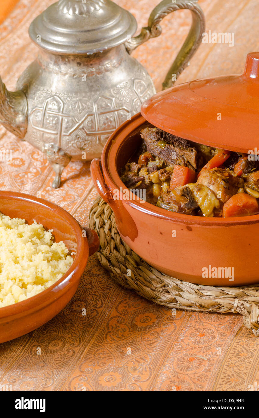 Moroccan lunch, homamade couscous in traditional clay pots Stock Photo