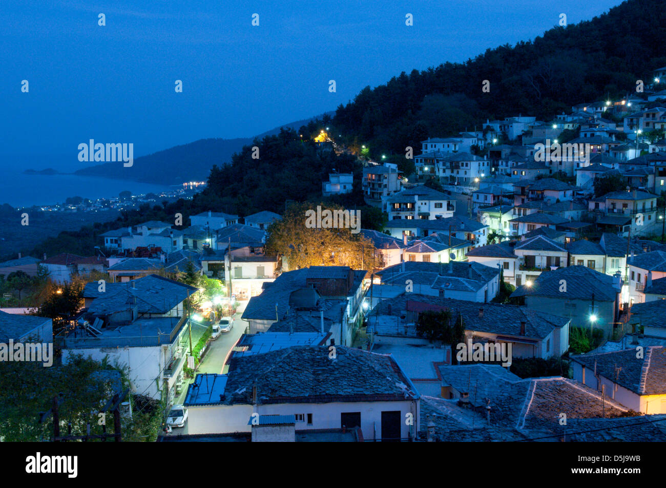 Greek island September Grey slate roofs on the old houses in the mountain village of Panagia Stock Photo