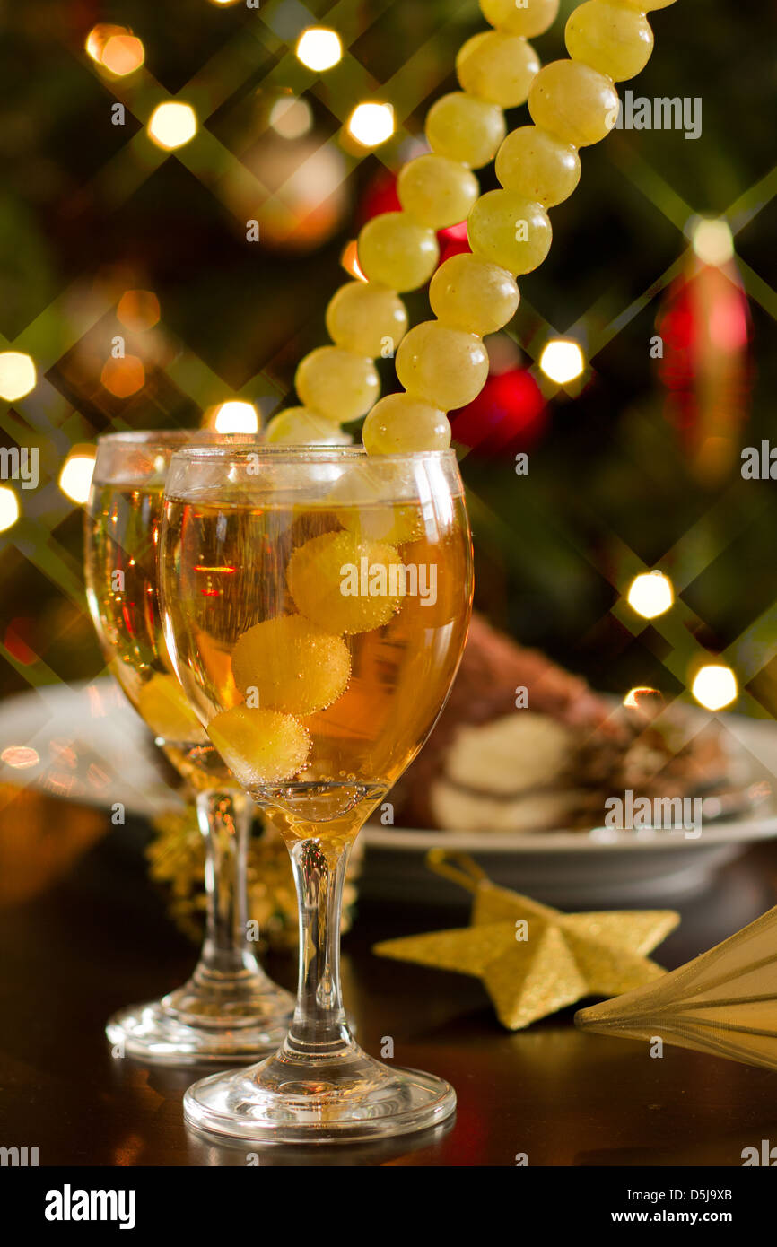 Happy New Year - champagne, grapes and party decoration Stock Photo