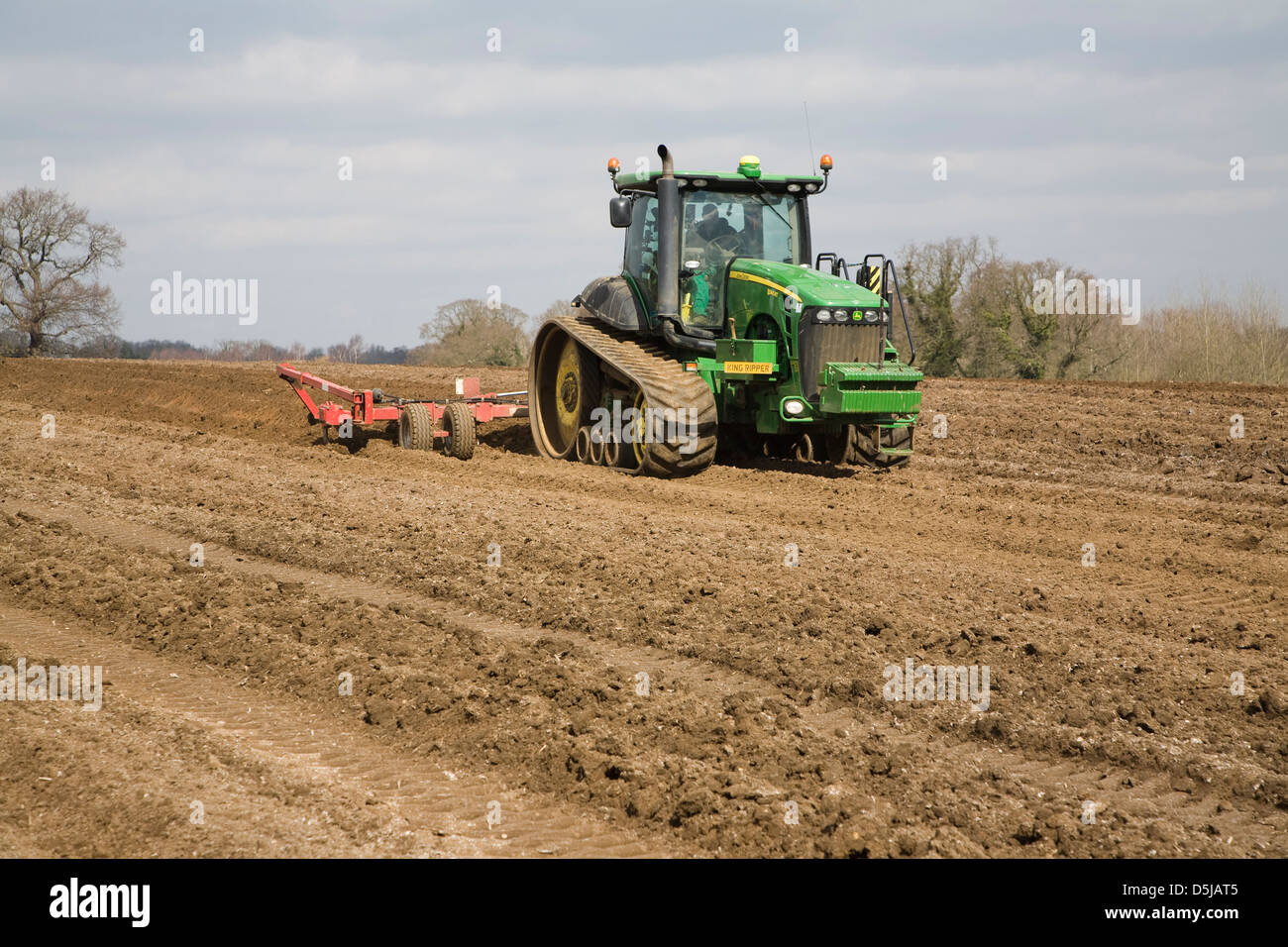 John Deere 8345RT tracked tractor working in a field, Suffolk, England Stock Photo