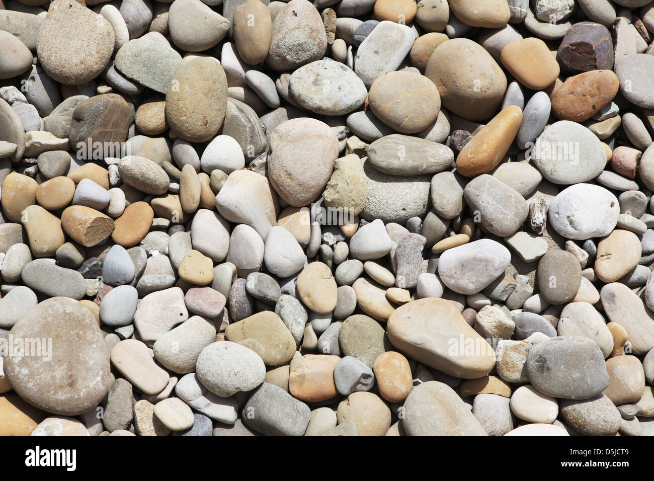 rounded beach rocks Stock Photo