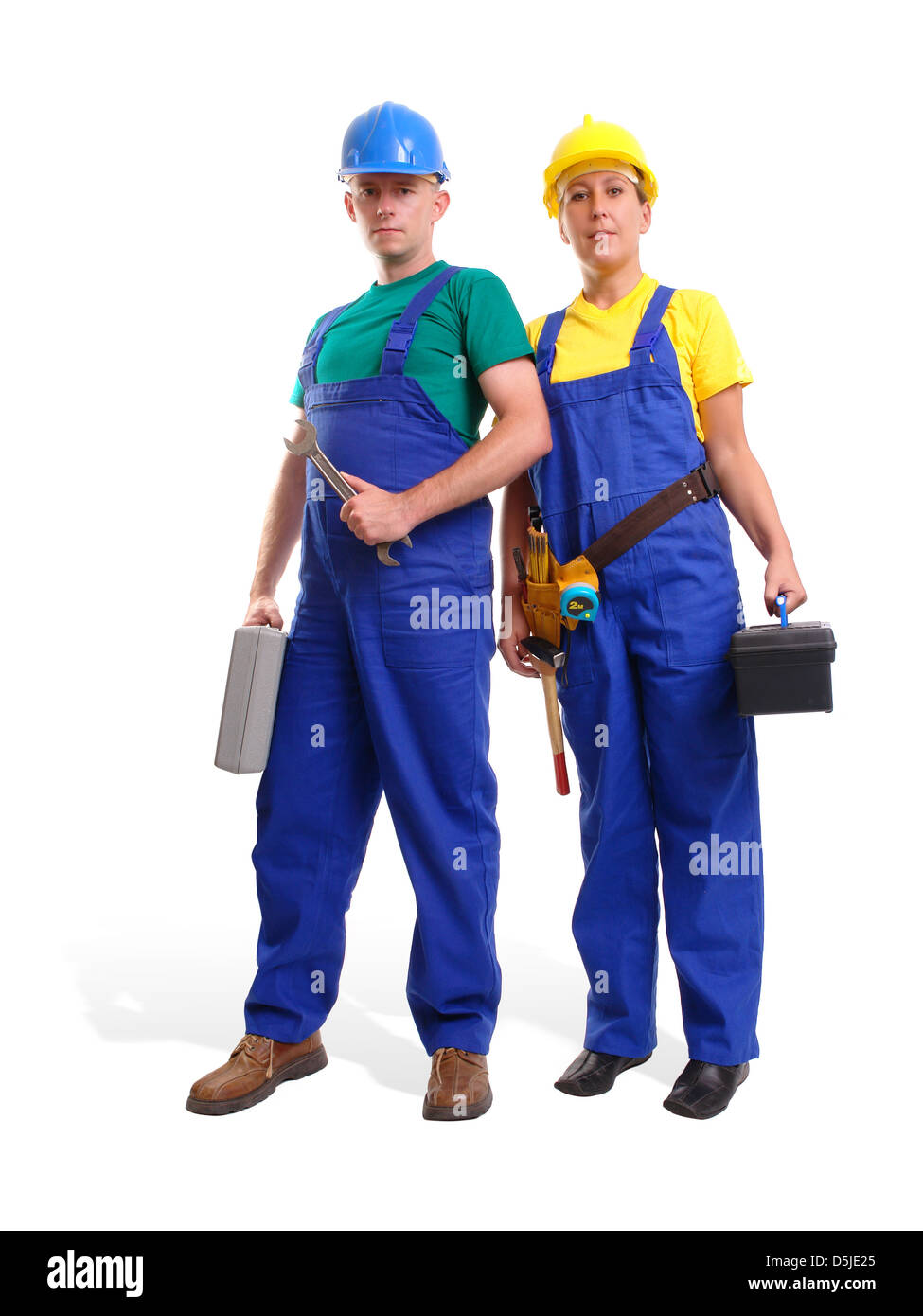 Serviceman and servicewoman wearing blue and yellow helmet and overall each holding toolboxes - isolated on white background Stock Photo