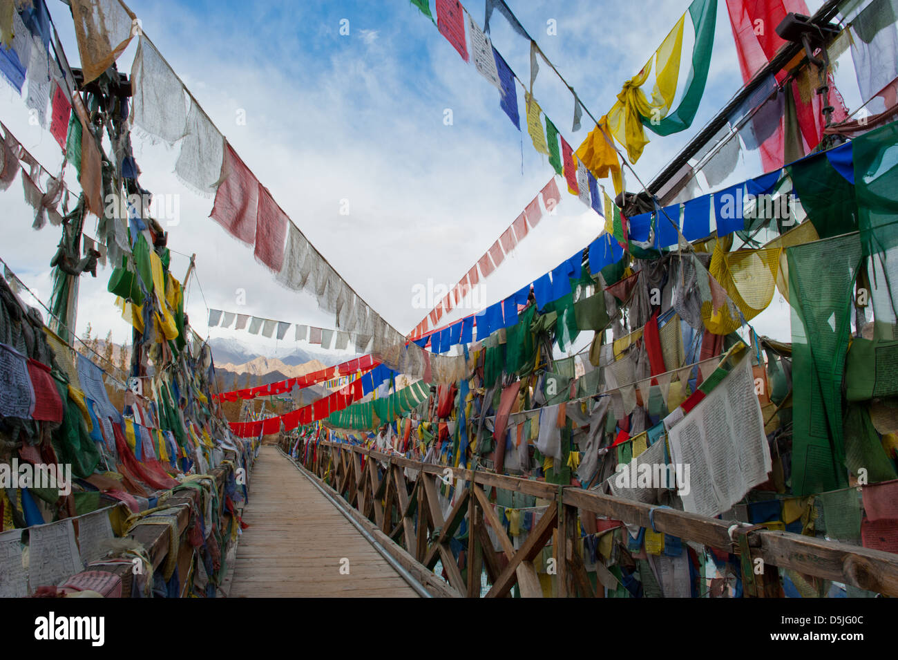 Prayer flags on a bridge over the Indus River at Leh, Ladakh, Jammu and Kashmir. India. Stock Photo