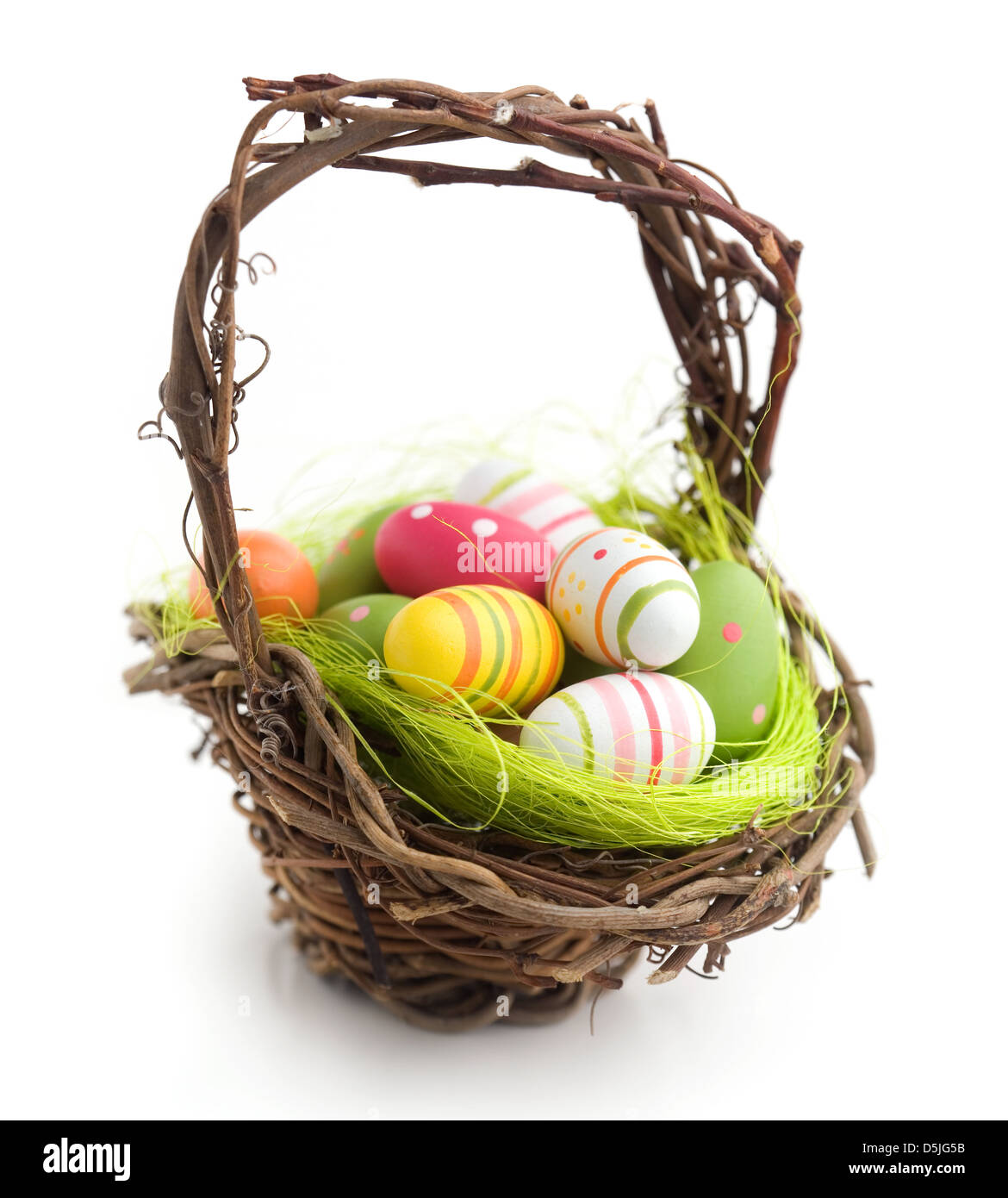 Colorful painted easter eggs in brown basket Stock Photo - Alamy