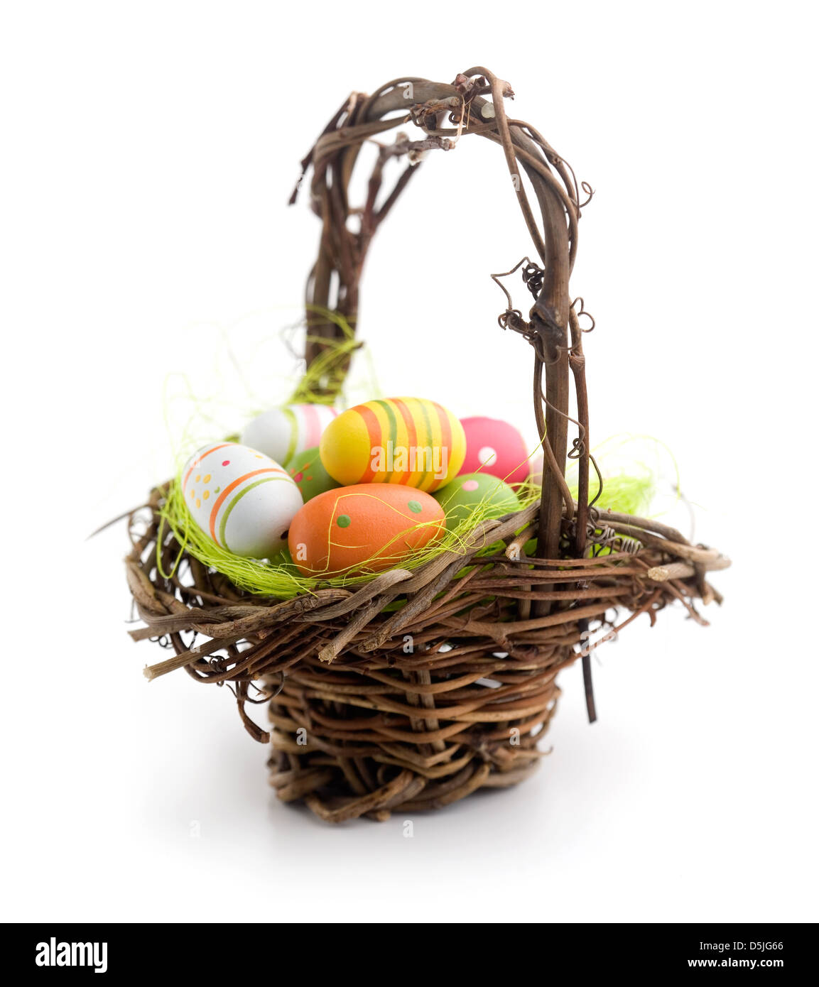 Colorful painted easter eggs in brown basket Stock Photo - Alamy