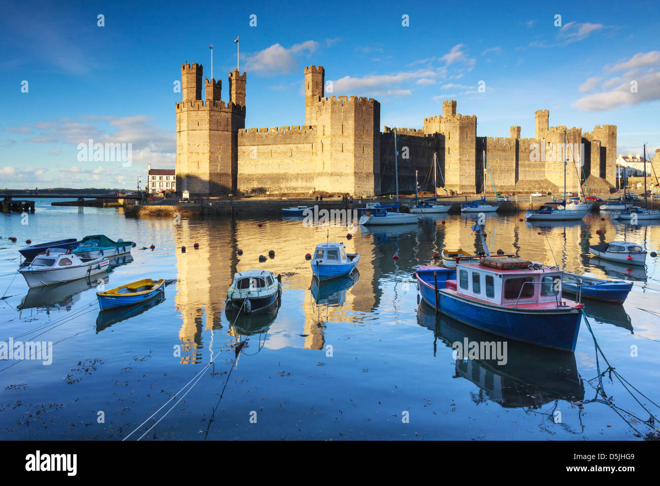 Caernarfon Castle in North Wales captured at hight tide Stock Photo