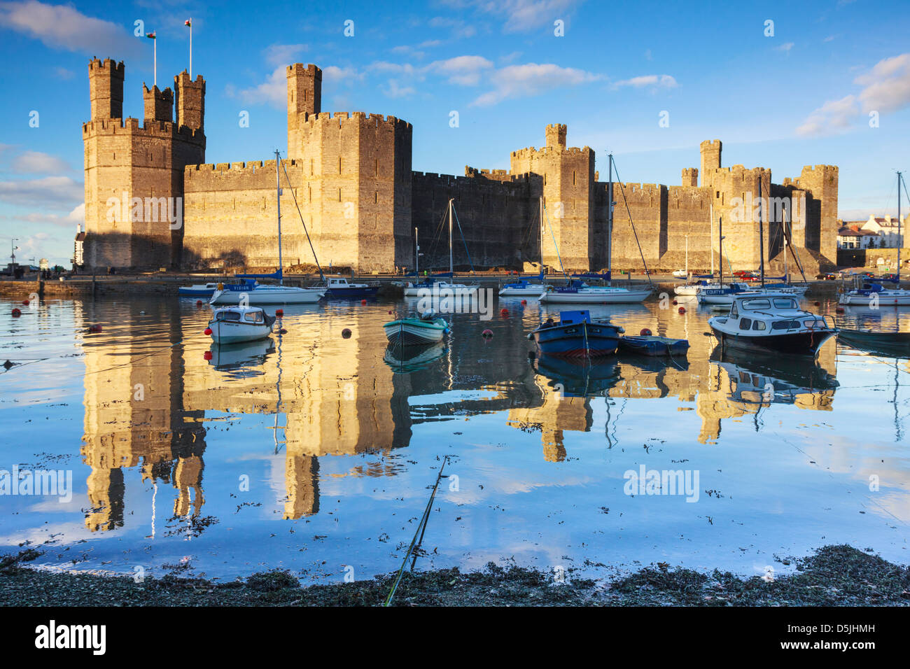 Caernarfon Castle in North Wales captured at hight tide Stock Photo