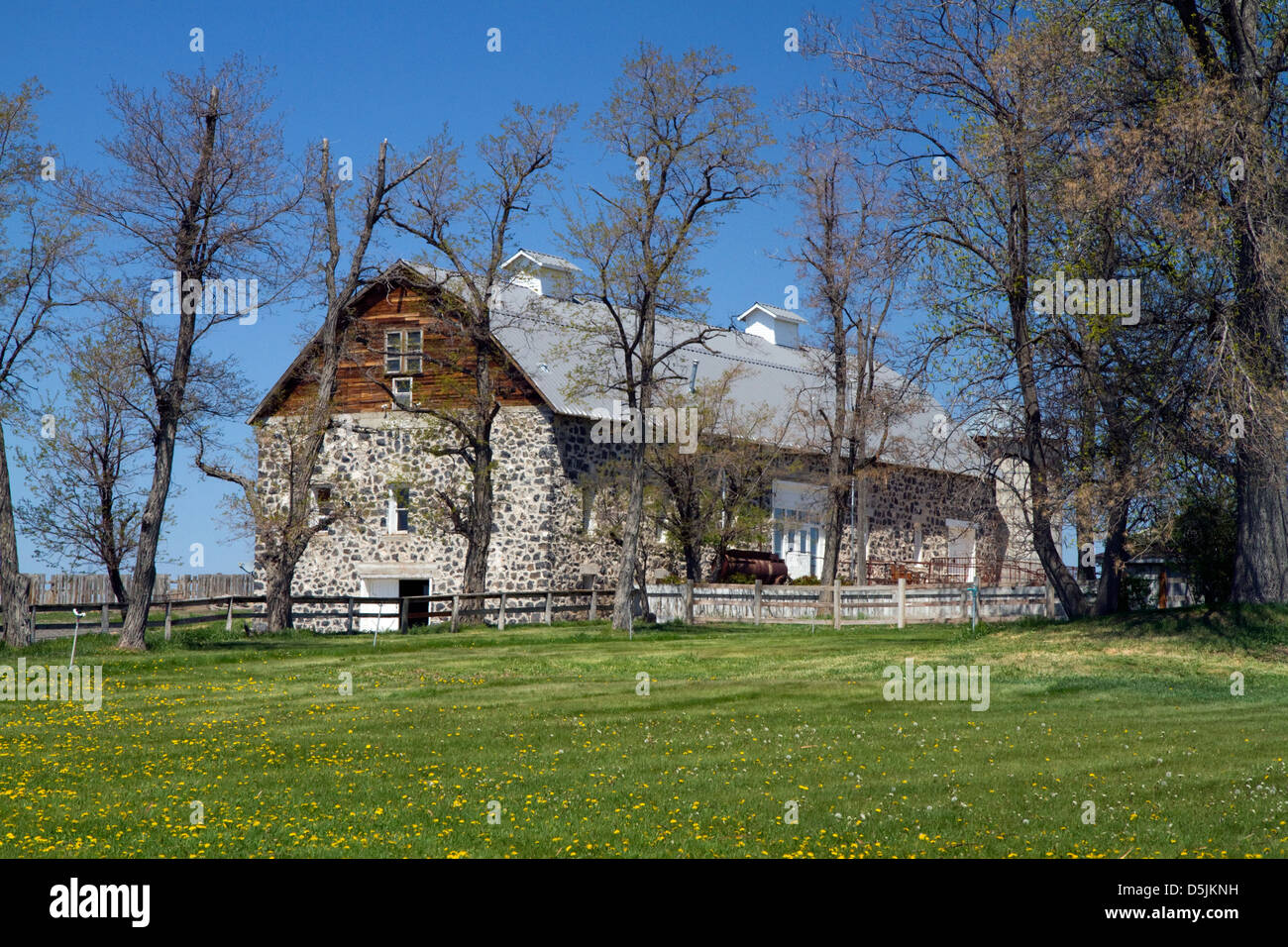 Farmstead with stone barn near Jerome, Idaho, USA. Stock Photo