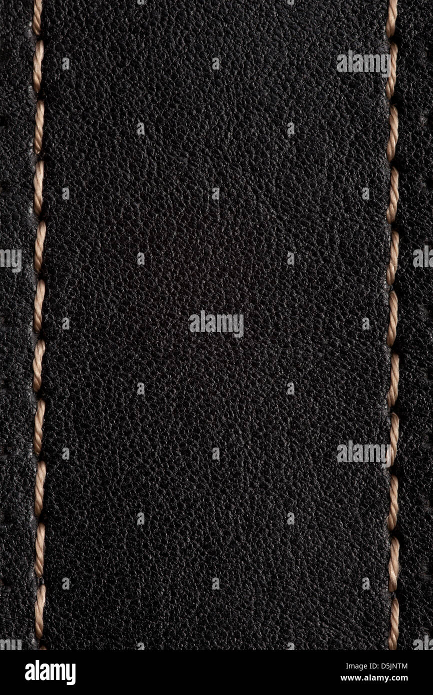 black leather background with light brown seam or rough pattern texture ...