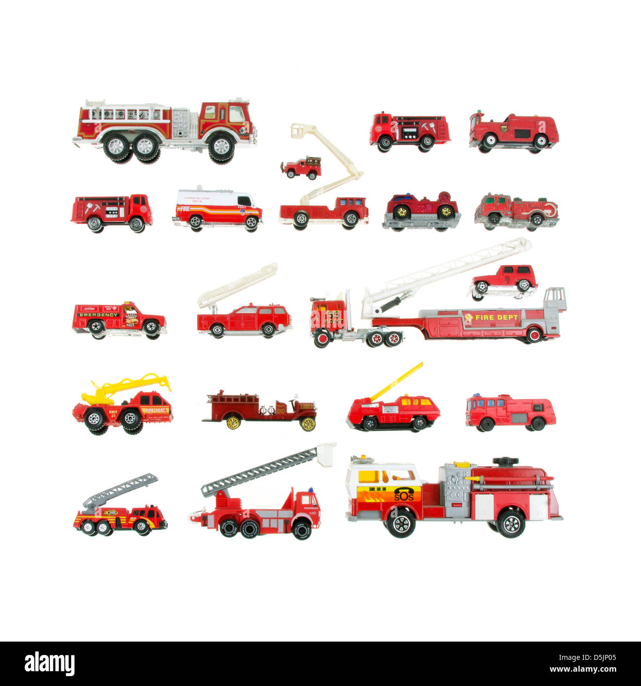 Vintage toy firetrucks arranged in a grid on a white background. Stock Photo