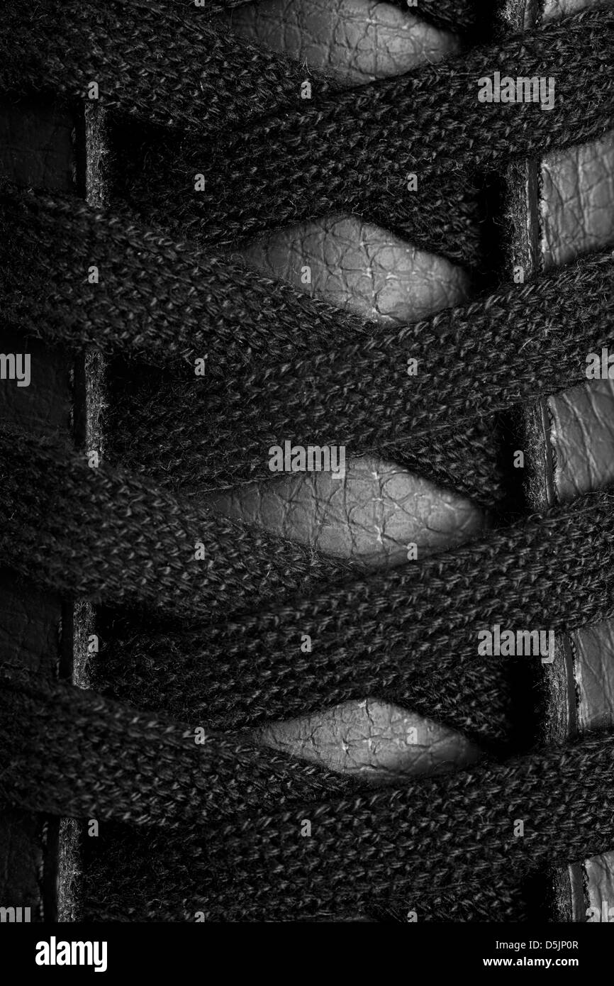 closeup of black shoelace in leather shoe or abstract background Stock Photo