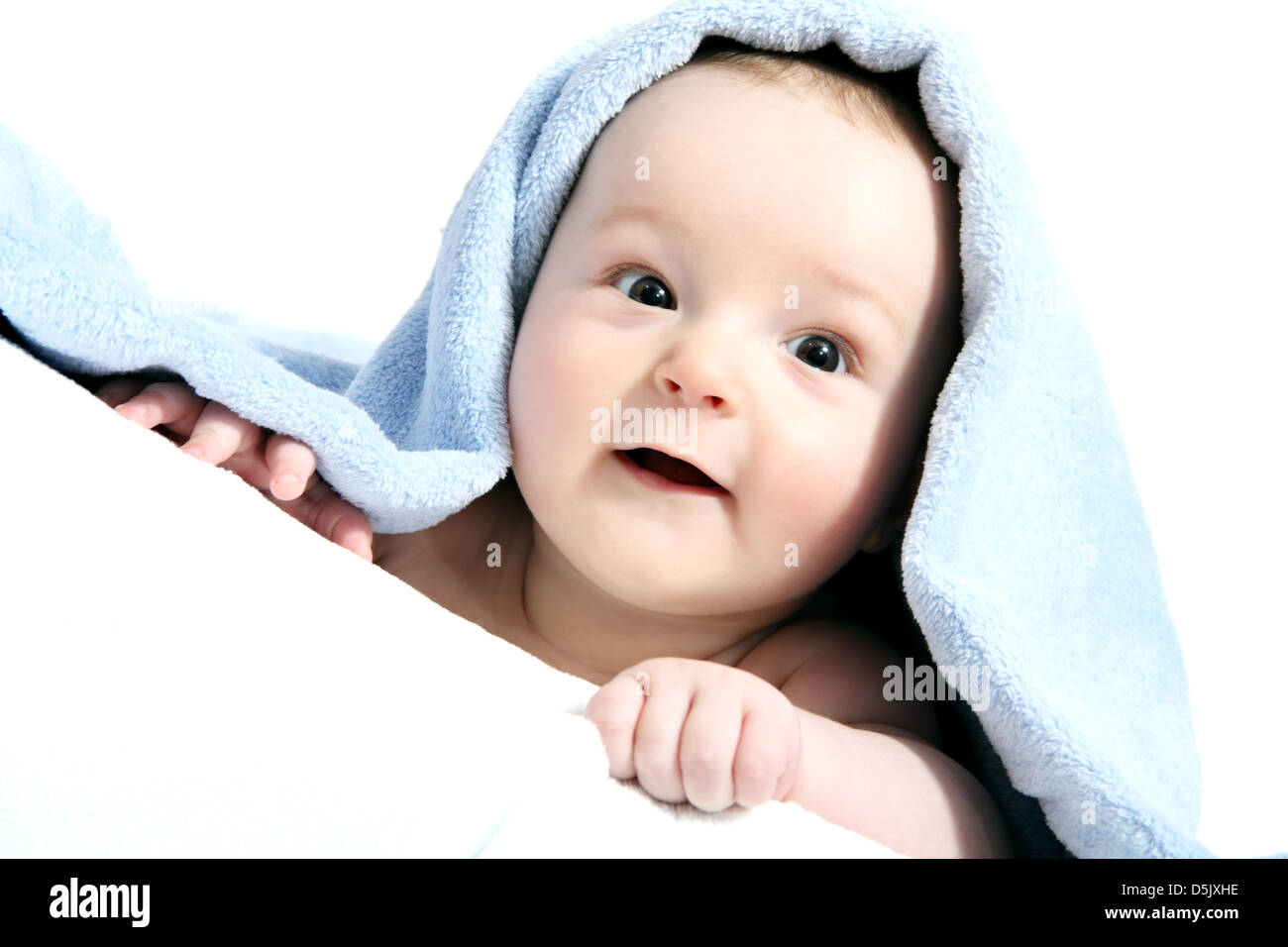 happy baby after bath under a blanket Stock Photo