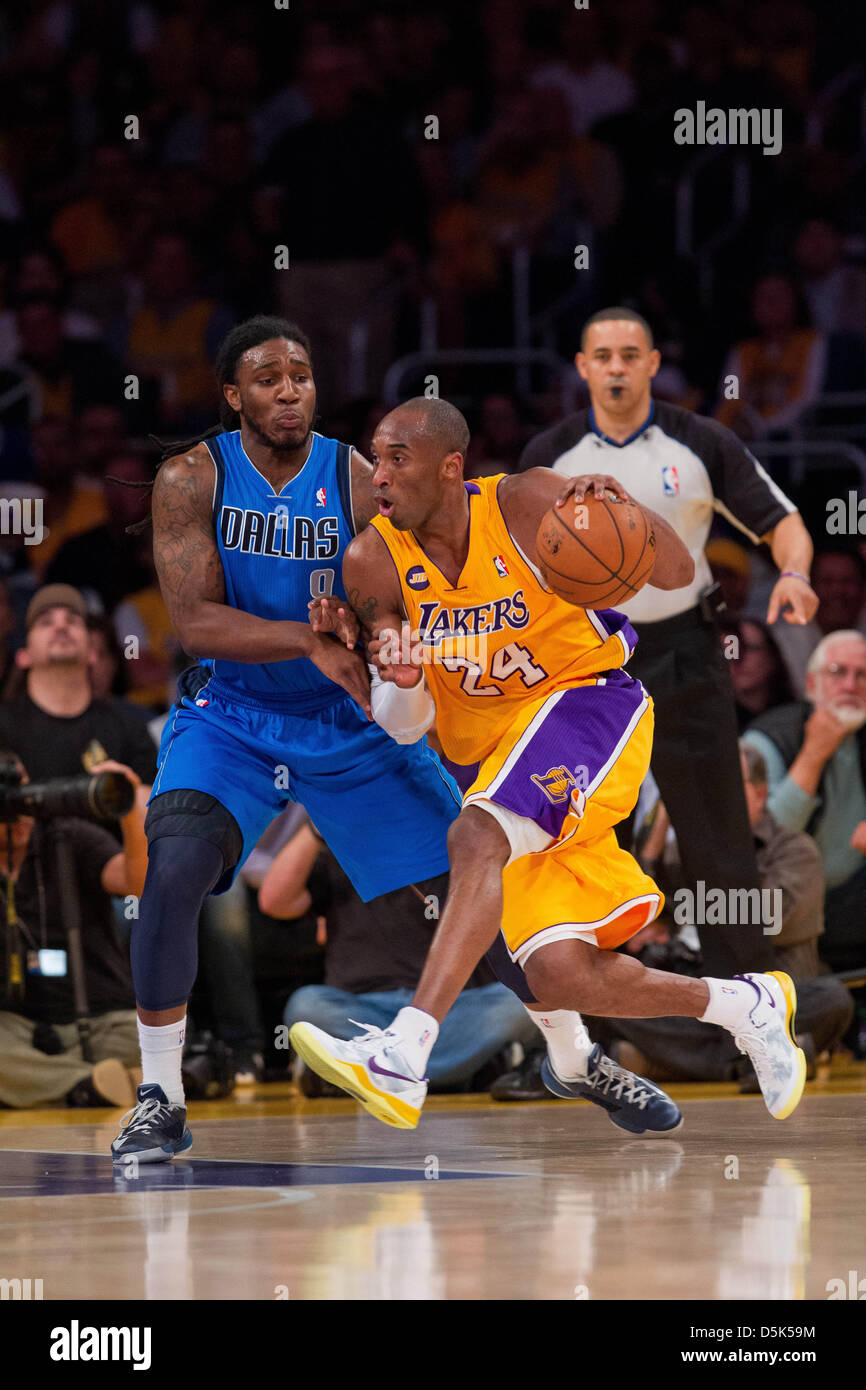 Los Angeles, California, USA. 2nd April 2013. Guard (24) Kobe Bryant of the Los Angeles Lakers drives to the basket while being guarded by Jae Crowder of the Dallas Mavericks during the first half of the Lakers 101-81 victory over the Mavericks at the STAPLES Center in Los Angeles, CA. Credit: Action Plus Sports Images / Alamy Live News Stock Photo