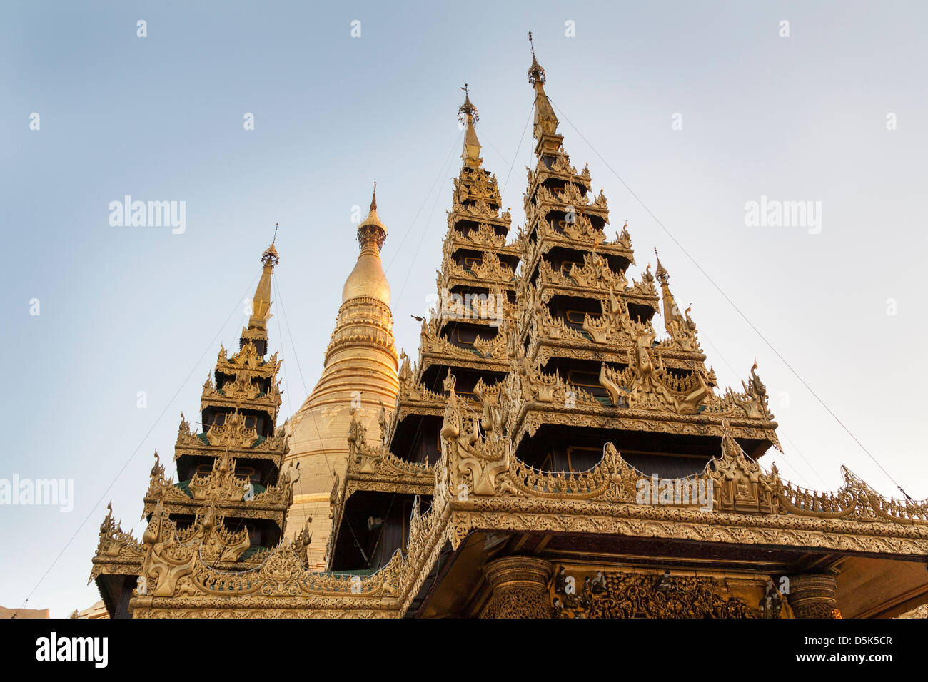 Ornate roof of a prayer hall and main stupa at Shwedagon Pagoda, Yangon (Rangoon), Myanmar, (Burma) Stock Photo