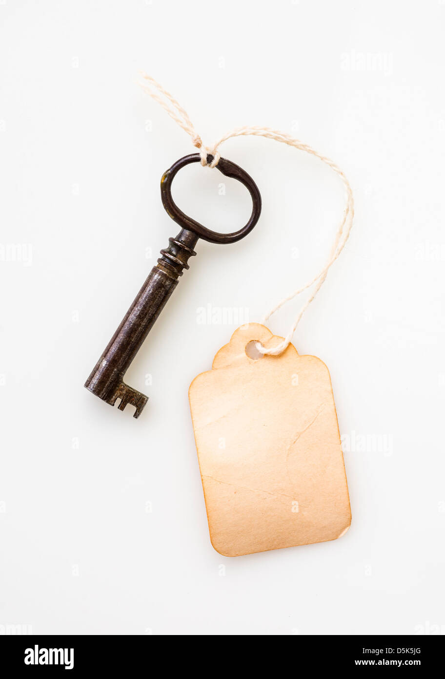 Antique key with tag Stock Photo