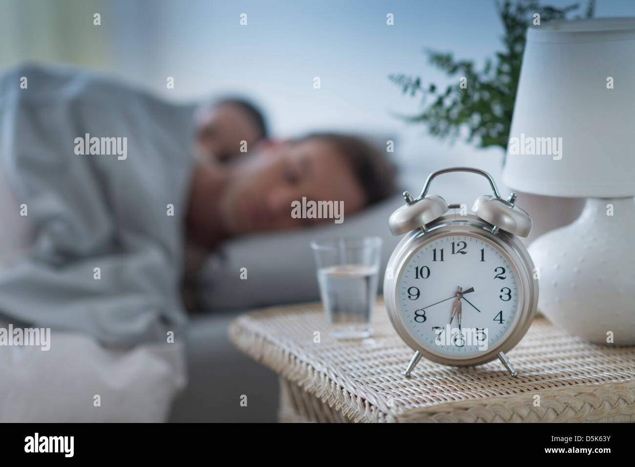 Alarm clock in bedroom Stock Photo Alamy