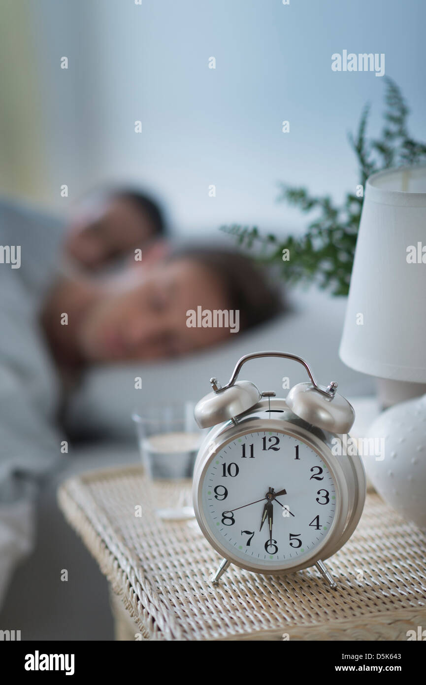 Alarm clock in bedroom Stock Photo Alamy