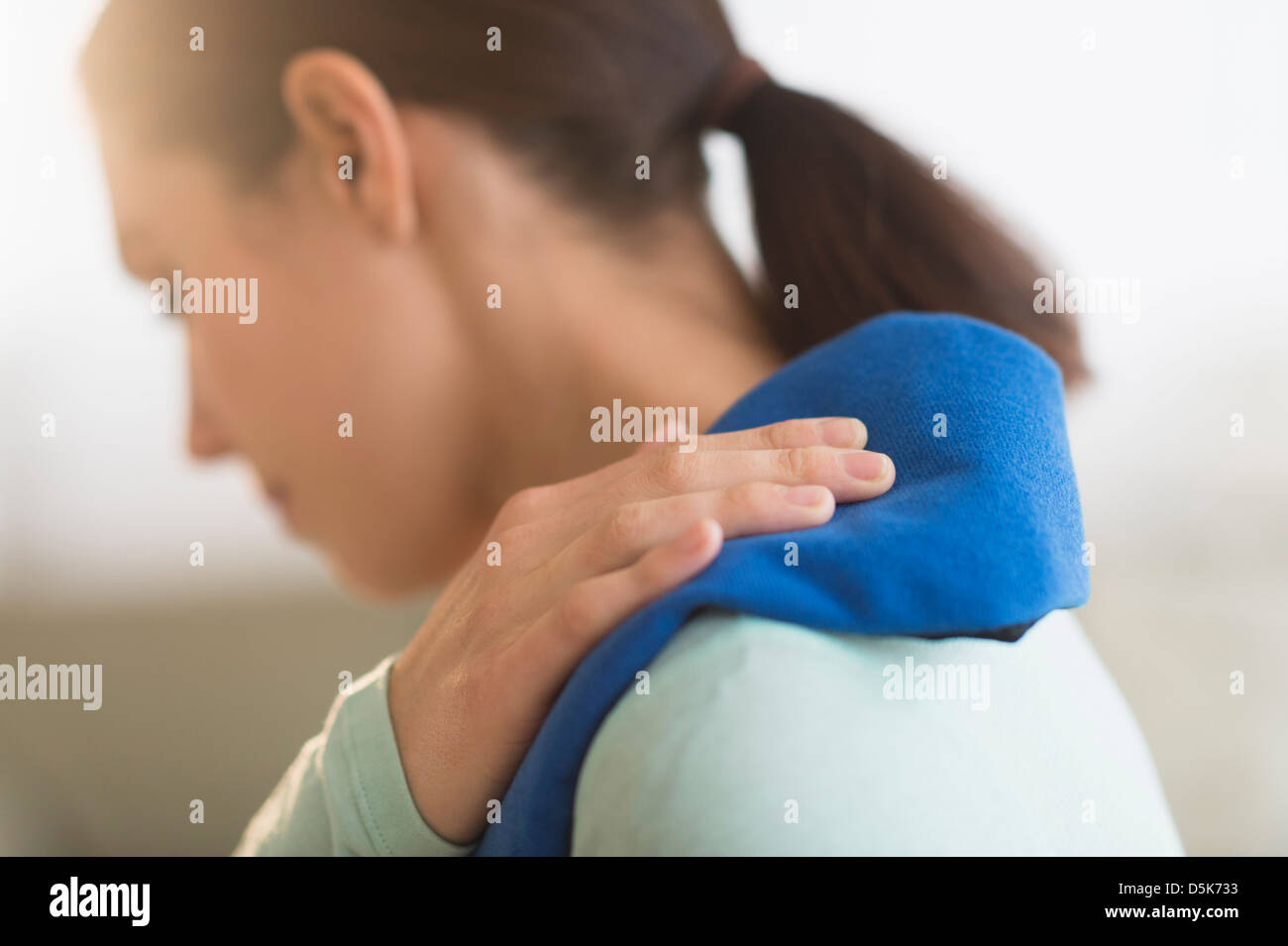 Woman touching aching back Stock Photo