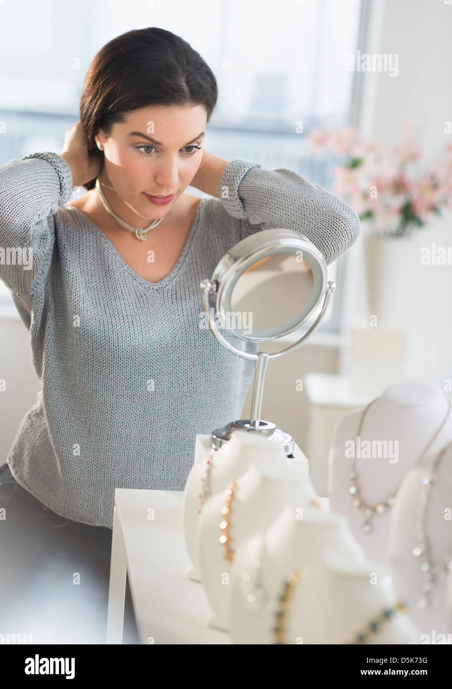 Woman trying on necklace Stock Photo