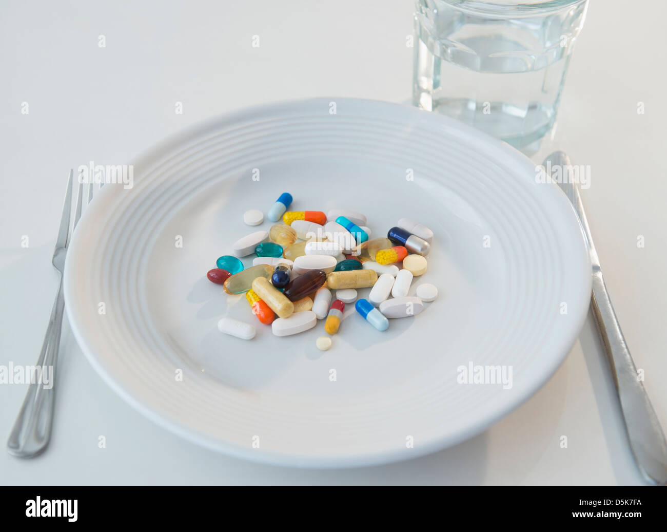 Studio shot of pills on plate Stock Photo