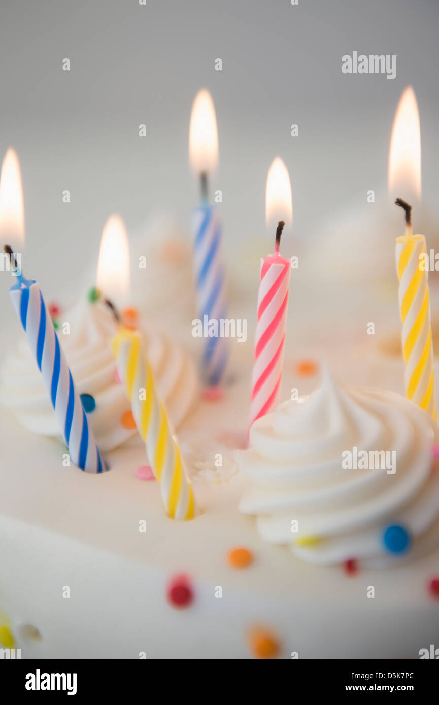 Studio shot of birthday cake with lit candles Stock Photo Alamy