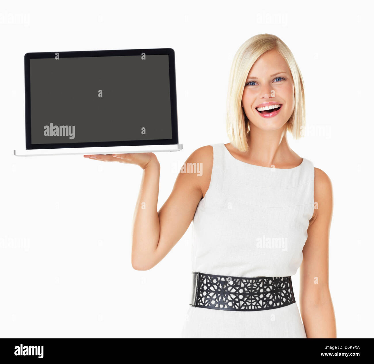 Studio portrait of young woman holding laptop Stock Photo - Alamy