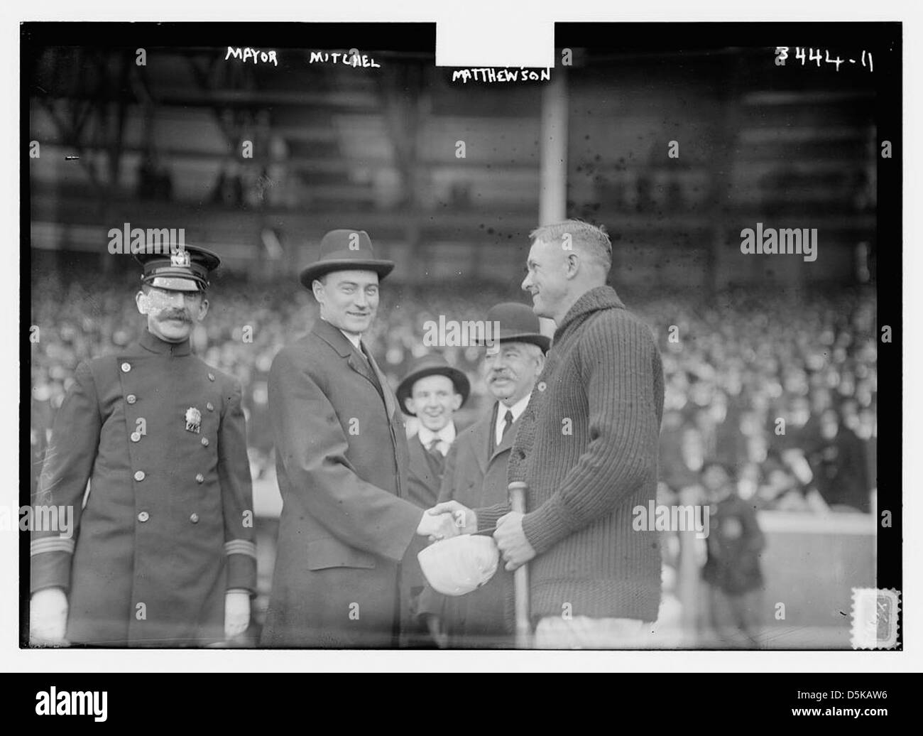 This photograph shows Mayor John Purroy Mitchel shaking hands with ...