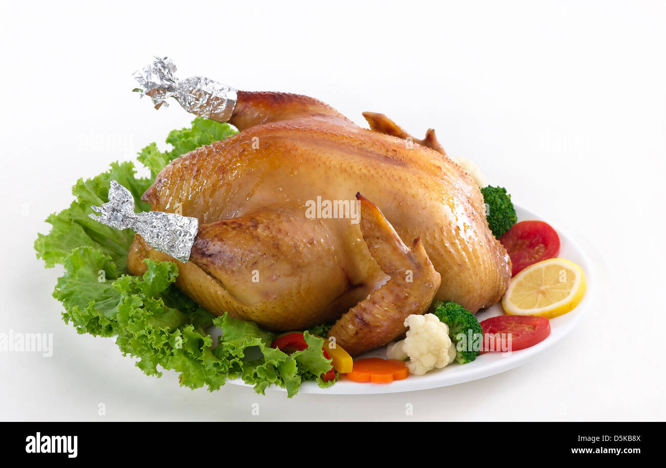 Eatable whole grilled chicken served with vegetable Stock Photo