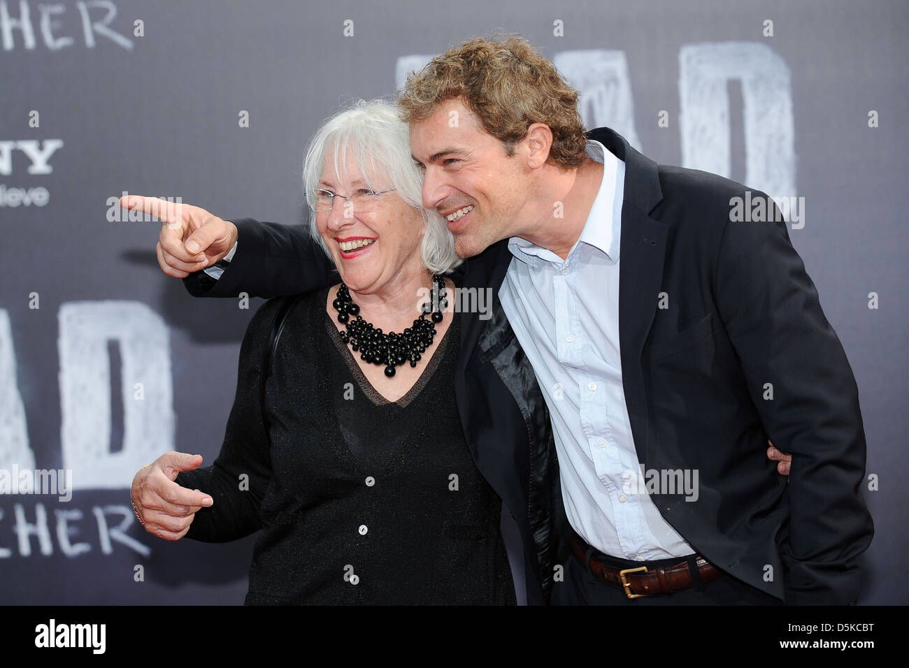 Gedeon Burkhard and his mother at the German premiere of 'Bad Teacher' at CineStar SonyCenter movie theatre. Berlin, Germany - Stock Photo