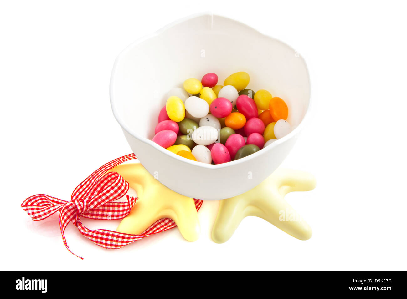 Easter chicken bucket filled with colorful eggs isolated over white Stock Photo
