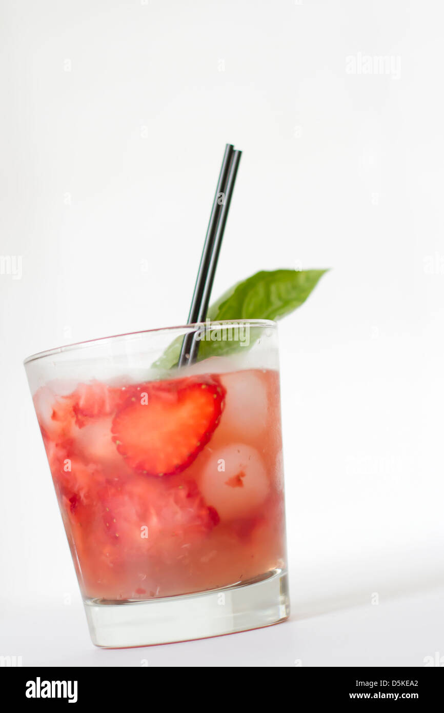 A refreshing strawberry, basil cocktail with a basil garnish Stock