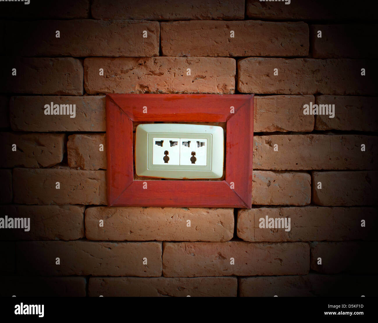 electrical outlet on a wall of red brick Stock Photo Alamy