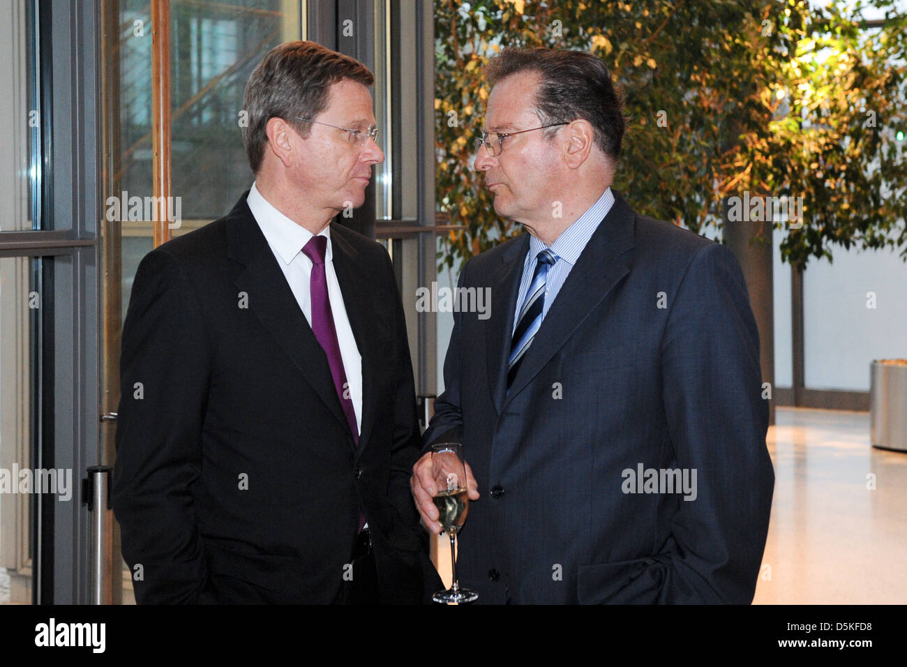 Guido Westerwelle and Dr. Manfred Balz steering commitee Telekom at manager meeting ofgerman telekom at Atrium. Berlin, Germany Stock Photo