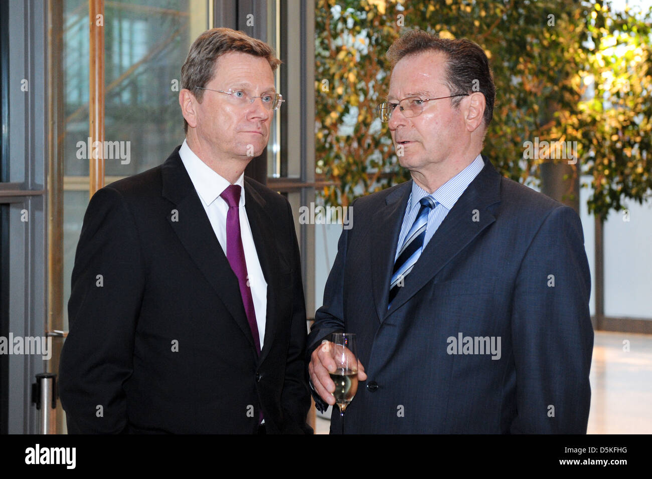 Guido Westerwelle and Dr. Manfred Balz steering commitee Telekom at manager meeting ofgerman telekom at Atrium. Berlin, Germany Stock Photo