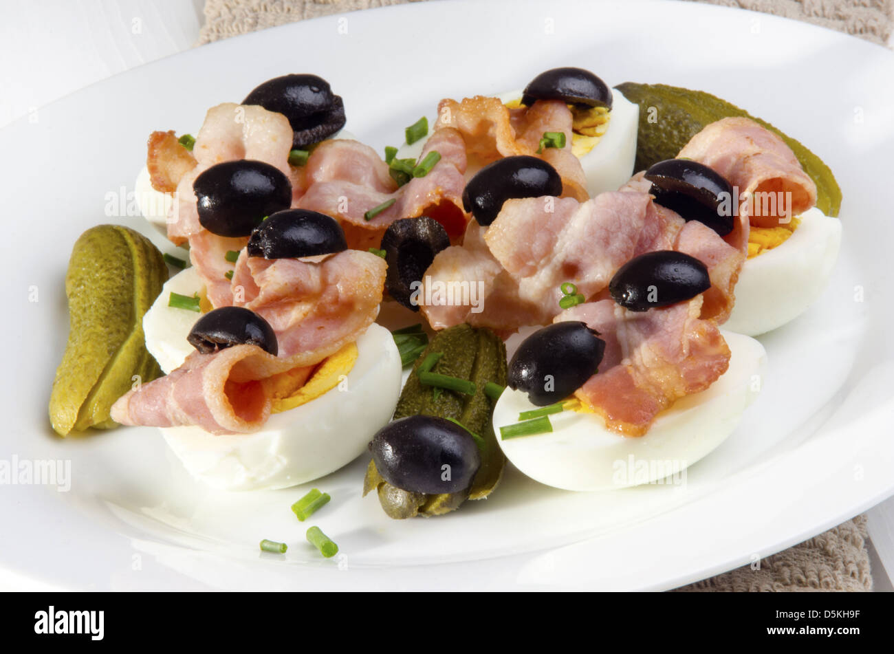 fresh salad with bacon, black olive and egg Stock Photo Alamy